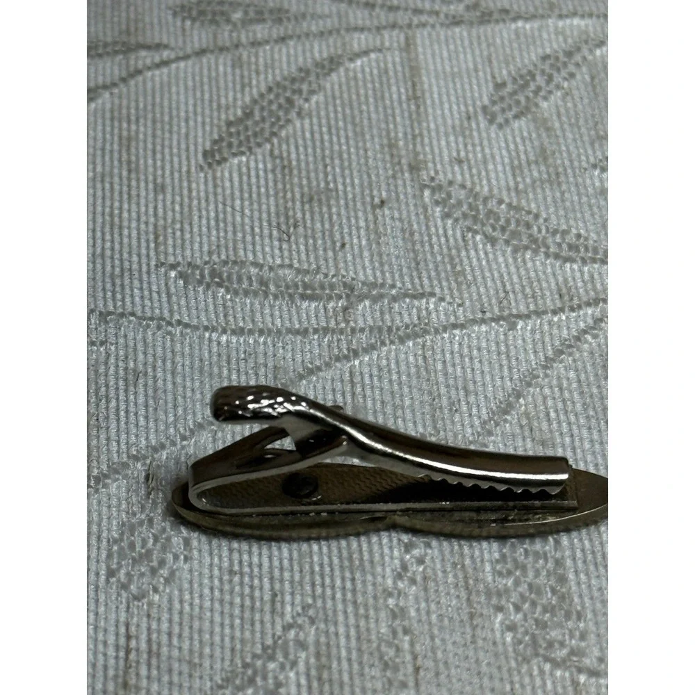 Vintage Anson tie clip featuring a crown‎ and sine wave